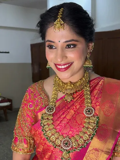 Another angle of this stunning Muhurtham look, highlighting the perfect blend of tradition and modern makeup techniques for a timeless result.