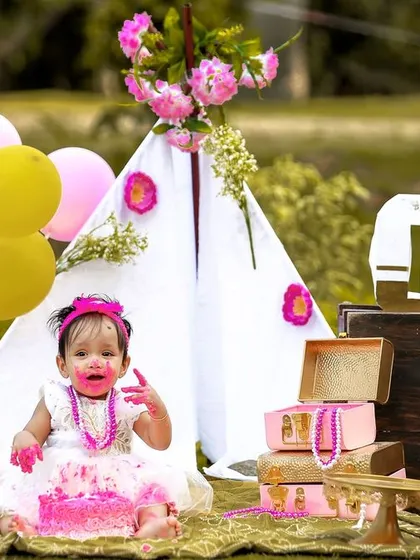 A candid shot of the birthday girl enjoying her cake during an outdoor photoshoot. The genuine mess and smiles are what make these sessions so special.