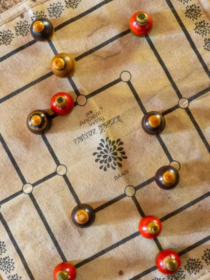 The traditional Indian board game of Daadi, or Nine Men's Morris, offers a great strategic challenge for two players.