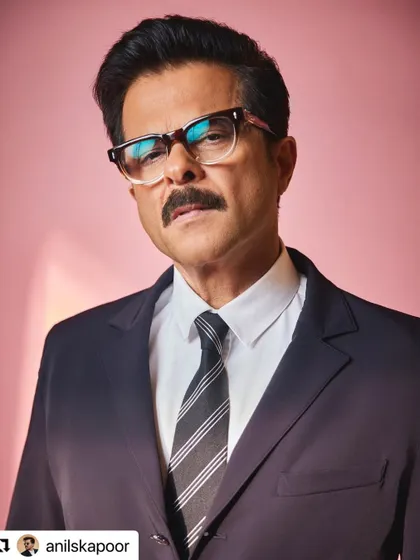 A close-up of Anil Kapoor's TIFF look. The hair is styled with volume and a slight side part for a classic, intelligent vibe.