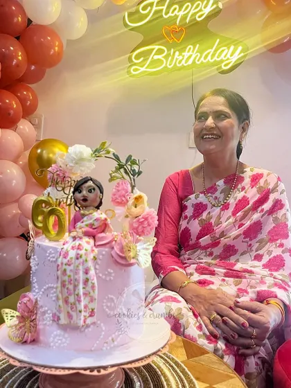 It's the best feeling to see my cake become a part of such a happy moment. I created this custom miniature doll cake for a 60th birthday, matching the fondant figure's saree to the birthday girl's actual outfit.