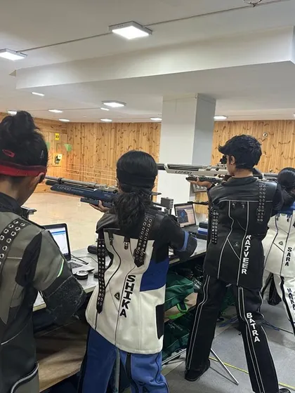 A view of my high-performance center during a training session. Shooters are geared up in professional kits, using our advanced electronic targets to hone their skills for upcoming rifle and pistol competitions.