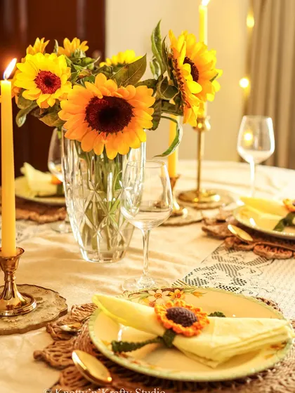 The full sunflower tablescape, glowing with warmth from the candles and the cheerful yellow hues.