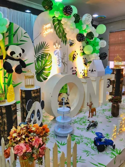 Another angle of the panda party, showing the attention to detail with small props and a white picket fence.