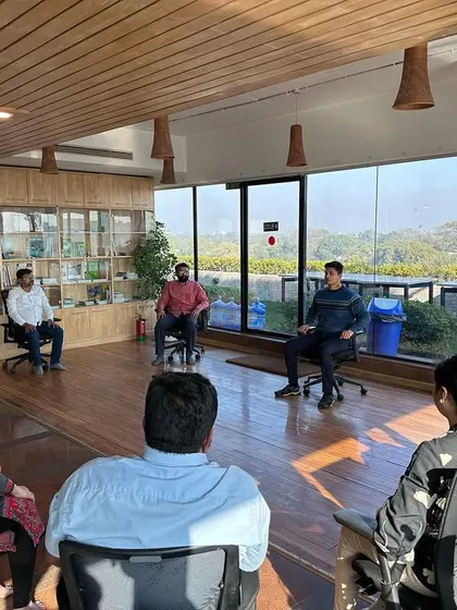 An interactive Q&A during a corporate workshop. I believe in creating a space where employees can openly ask questions about their physical and mental health challenges, allowing me to tailor the practices to their specific needs.