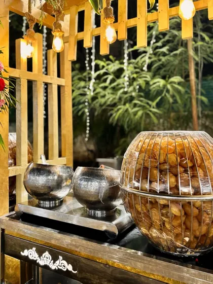 My Pani Puri counter is designed for elegance and ease. Guests can enjoy their favorite street food from our beautiful setup, complete with large bowls of spicy and sweet water and a mountain of crispy puris.