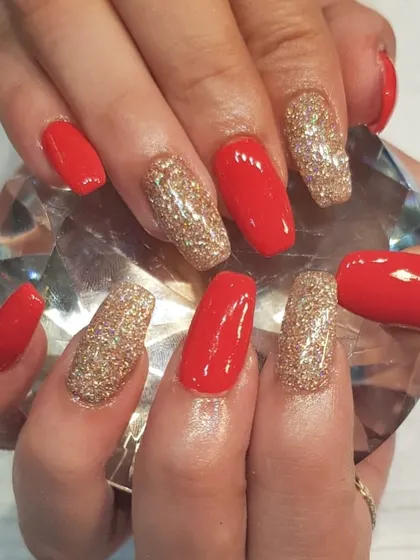 Christmas nails are all ready. This bold holiday look features alternating bright red and dazzling gold glitter nails for a glamorous and festive statement.