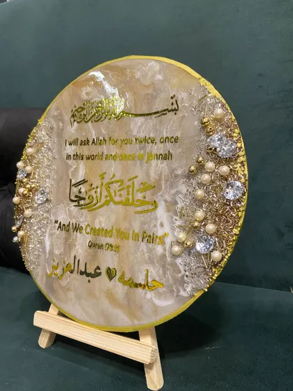 A side view of the engagement plaque, showing its depth and the careful placement of the embellishments.