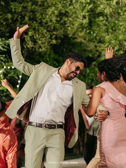 The couple, Ameera and Richard, dancing with their friends at the reception. I capture the energy and fun of the party to show the celebratory side of your wedding.