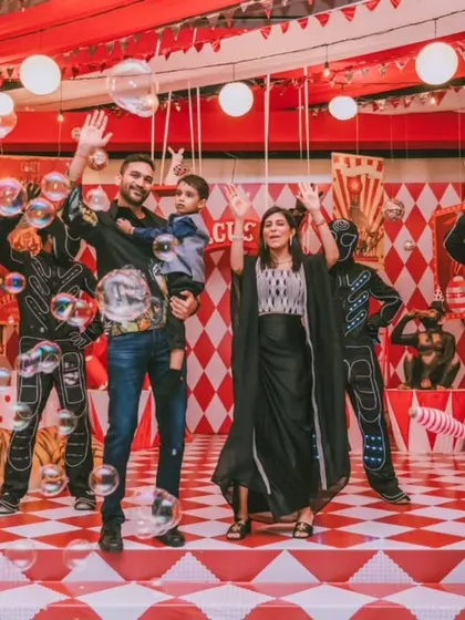 A grand family photo on the fully decorated circus stage, complete with performers. This shot captures the energy and scale of the event, a perfect memento of a spectacular day.