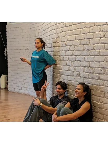 Downtime between drills is for rest, laughter, and connection. The community vibe is just as important as the dance itself.