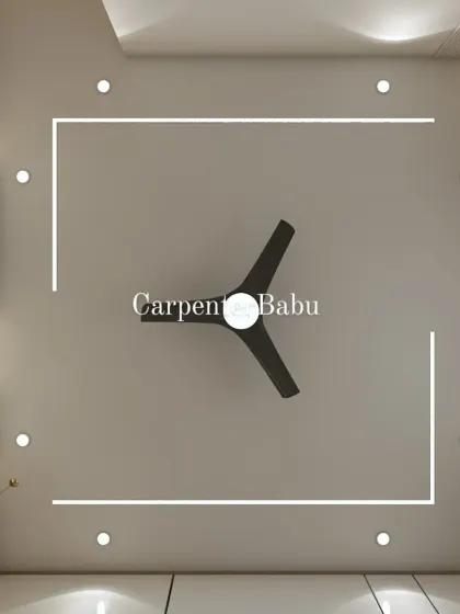 A minimalist false ceiling design with clean, linear lighting. This adds a modern, graphic element to the room without being overpowering.