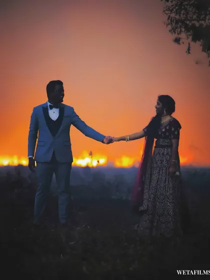 A powerful pre-wedding silhouette against a fiery backdrop. This image showcases our ability to capture unique and dramatic moments as they happen.