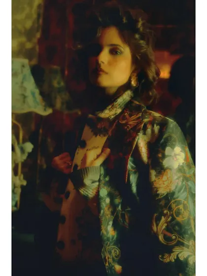 A close-up portrait from "Love in Future Past." The layered styling and direct gaze create a sense of confidence and defiance, marking a turning point in the editorial's narrative.