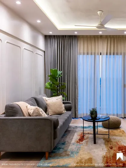 A comfortable living area from my 'Tranquil Tones' project, as seen in The Architect's Diary. The space is grounded by a colorful rug, adding warmth to the neutral palette.