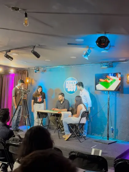 A full view of the stage setup during my live show, with multiple audience members participating in the magic.