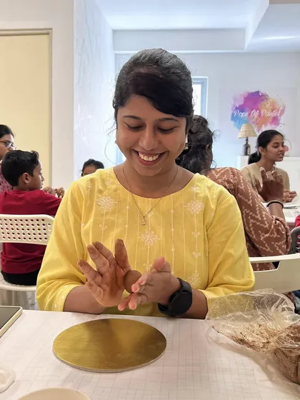 The smile of someone completely lost in the creative process. Working with clay is a wonderfully mindful and stress-relieving activity for adults too.
