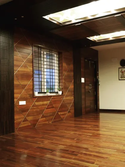 The geometric wall paneling adds a dynamic quality to the main office space.