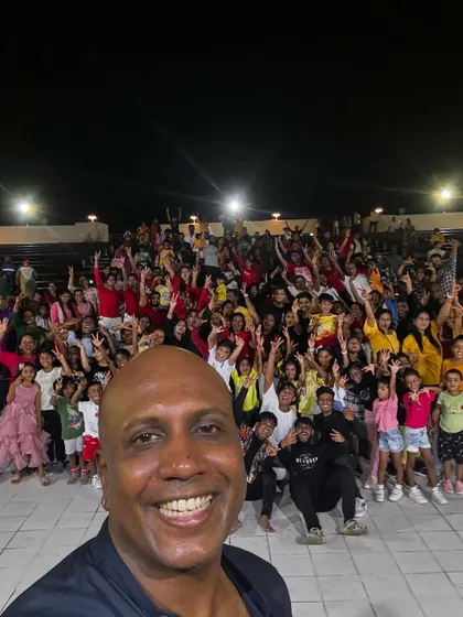 A selfie taken by our director with a massive crowd of students and audience members at our outdoor showcase. The energy is incredible.