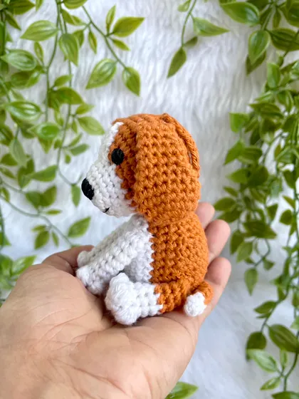 A tiny crochet dog keychain, perfect for any dog lover. This little beagle is small enough to fit in your palm but is full of character.