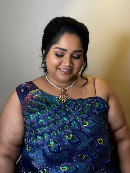 The happy and confident smile of a satisfied client. It's always a pleasure to get clients ready for their family's special occasions.