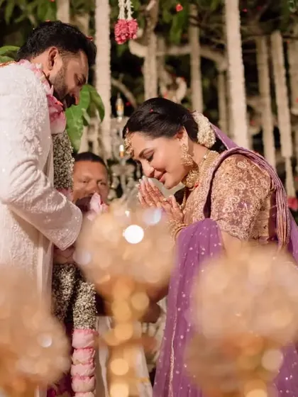 The bride and groom performing a ritual during their beautiful South Indian wedding ceremony.