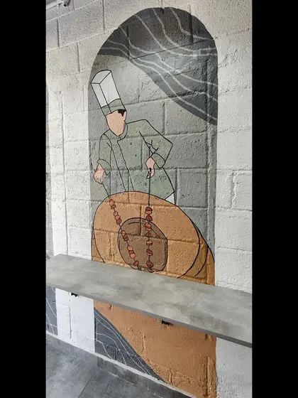 Detail of the tandoor chef panel.
