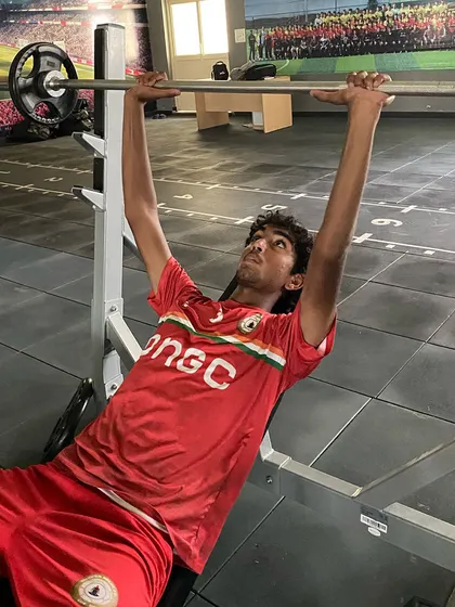 A player performs a bench press in our gym. Building explosive power is key for actions like sprinting, jumping, and shooting, and our programs are tailored to develop this.