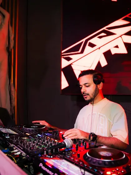 Another shot of me focused on the mix, with the club's unique decor in the background.