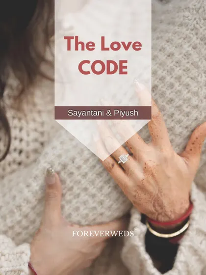 Sometimes the story is in the details. This shot focuses on Sayantani's hands, showing her engagement ring and traditional henna, as she embraces Piyush. It’s a beautiful way to symbolize their commitment.