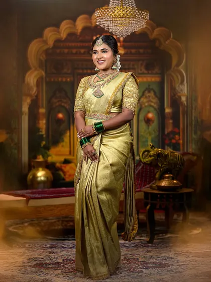 A full-length shot capturing the elegance of the golden saree.