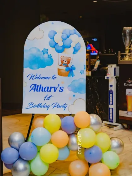 Welcome to the party! This personalized welcome sign for Atharv's first birthday features a hot air balloon teddy bear theme, setting a charming tone right from the entrance.