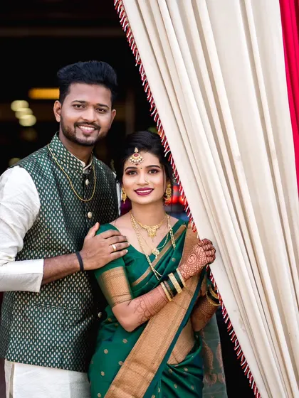 A happy and engaging portrait of the couple smiling directly at the camera, perfect for sharing with family and friends.