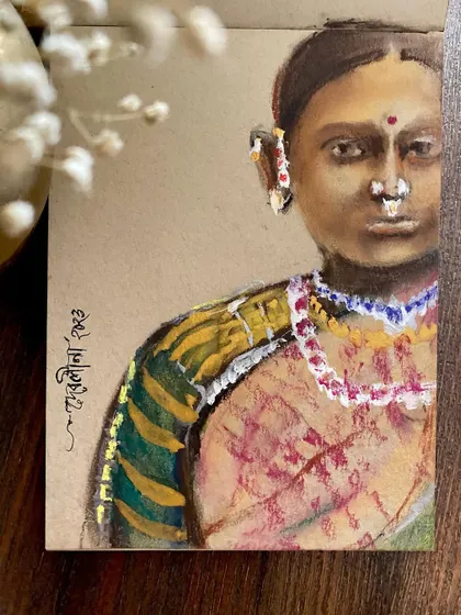 'Aurat' (Woman). A mixed media portrait on tanned paper, exploring the strength and beauty of an Indian woman. The texture of the paper adds a rustic feel to the piece.