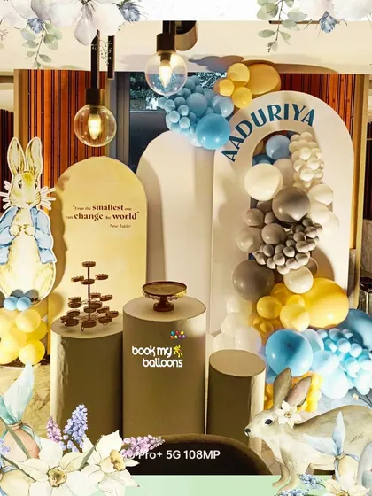 This Peter Rabbit theme for Aadurya's birthday was utterly charming. The setup featured the beloved character, a quote from the book, and a soft color palette of blue, yellow, and grey balloons for a classic storybook feel.
