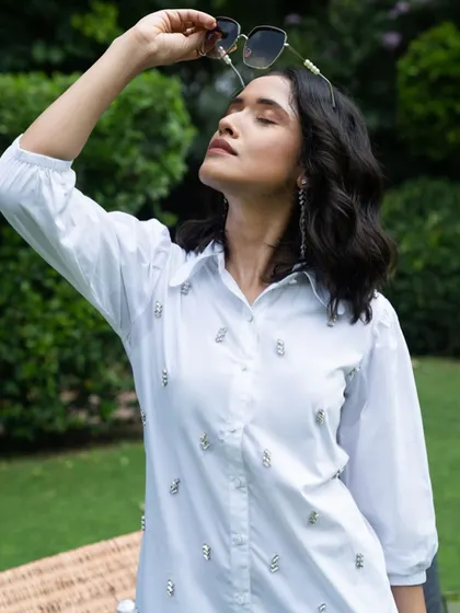 A sun-kissed shot from the same outdoor campaign. This image has a relaxed, summery feel, perfect for a brand's seasonal lookbook or social media.