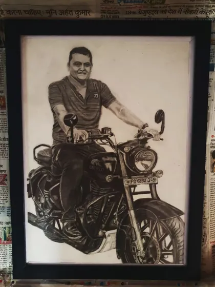 A custom pencil portrait is a powerful way to celebrate a passion. This A3 size sketch of a man on his Royal Enfield motorcycle was a special commission, turning a beloved photo into a detailed, framed piece of art.