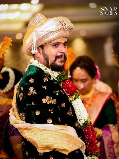 A portrait of the groom in his handsome green velvet sherwani. We ensure the groom's style and personality are just as beautifully captured as the bride's.