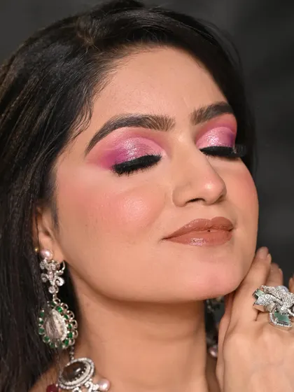 An extreme close-up of the pink cut-crease. You can see the clean lines and smooth blending that are key to this technique.