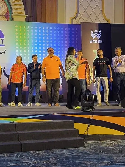Guiding a group of participants through an on-stage activity. These team-building exercises are a great way to foster collaboration and fun.