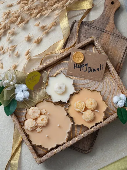 This beautiful Diwali hamper features a collection of my floral-scented candles in a decorative tray, complete with a "Happy Diwali" tag.