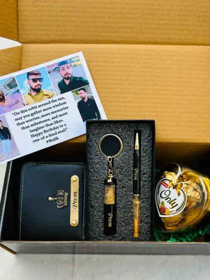 Make his birthday extra special with a personalized card featuring his photos. This hamper combines a custom card with a personalized wallet, keychain, pen, and a large Ferrero Rocher chocolate.
