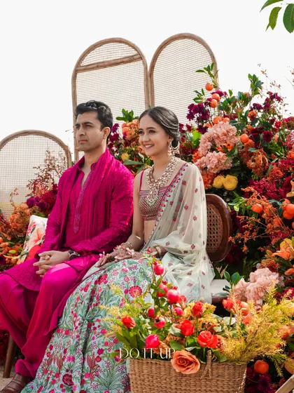 The happy couple at their vibrant Haldi in Udaipur. The decor, with its explosion of color, perfectly matched the joyful energy of the ceremony.
