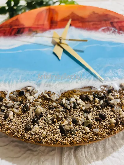 A close-up on the textured shore of my Jagannath Puri wall clock, crafted with real sand and stones to bring the feeling of the holy city's coastline right into your home.