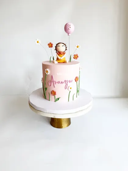 A simple and cutesy design for a 3rd birthday. This 1.5kg Chocolate-Orange cake features a hand-sculpted figurine in a field of delicate flowers.
