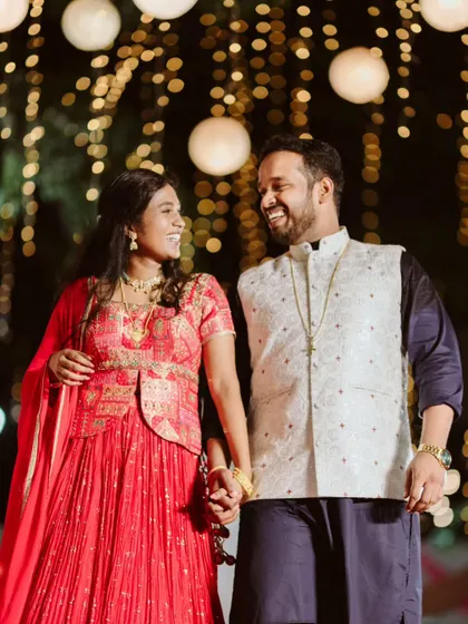 The pure, unscripted joy between Melvin and Marilyn at their reception. Against a backdrop of dreamy bokeh lights, their laughter and connection show that the best moments are the ones that are simply felt.
