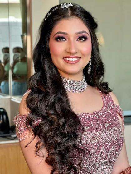 A beautiful smiling portrait that shows how the makeup enhances her natural features.