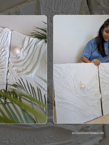 Another view of the white textured triptych, this time styled with plants to show how it brings a natural, calming feel to a space.