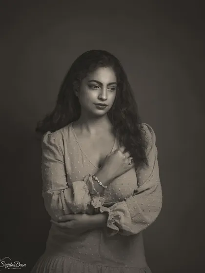 A slightly different monochrome treatment of the same portrait, showing how editing choices can alter the mood. This version has a softer contrast, giving it a more gentle and dreamy quality, like a faded memory from a bygone era.