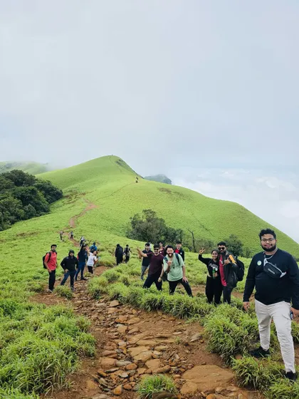 A wide shot of the trekking trail at Kudremukha, with our group spread out and enjoying the vast landscape.